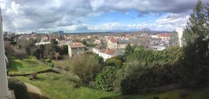 a view of a city with buildings and trees at Appartement 4 personnes, 2 ch, parking gratuit et facile in Montceau-les-Mines