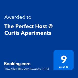 a blue sign with the text awarded to the perfect host o curls apartments at The Perfect Host @ Curtis Apartments in Gladstone