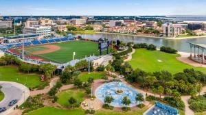 an aerial view of a park with a baseball field at Downtown Navy Blue in Pensacola