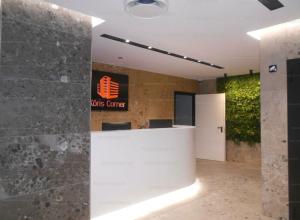 a lobby with a cvs centre sign on the wall at Kőris Pool Apartments in Budapest