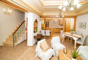 a living room with a table and a dining room at Casa di Emmanuel in Kalymnos