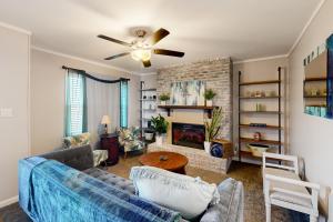 a living room with a couch and a fireplace at Getaway on Gossett in Spartanburg