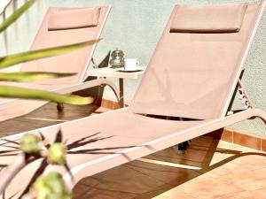 two folding chairs sitting next to a table at Atico San Crispin in Cartagena