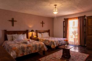 Postel nebo postele na pokoji v ubytování Hotel Refugio Victoria