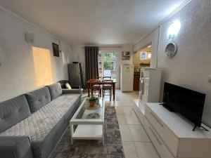 a living room with a couch and a table at Etno village Mihailovic in Herceg-Novi