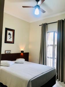 Postel nebo postele na pokoji v ubytování Hotel de Minas