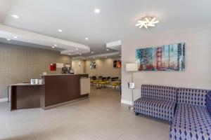 a waiting room with a counter and chairs in a hospital at Best Western Red Coach Inn in San Francisco