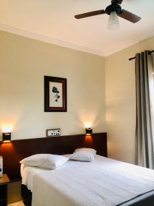 Postel nebo postele na pokoji v ubytování Hotel de Minas