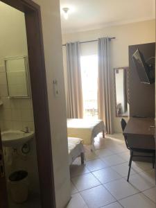 Postel nebo postele na pokoji v ubytování Hotel de Minas