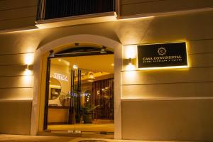 a store with a sign on the side of a building at Casa Continental Hotel Boutique & Suites - Adults Only in Mérida