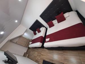 Кровать или кровати в номере Casa Hotel Mónaco