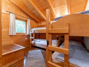 a log cabin with two bunk beds in it at Chalet Lisa in Piesendorf