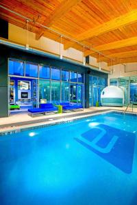 a large swimming pool in a house at Aloft Mount Laurel in Mount Laurel