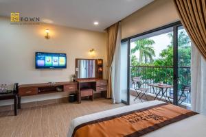 Μια τηλεόραση ή/και κέντρο ψυχαγωγίας στο Luxy Park Hotel & Apartments - MTown