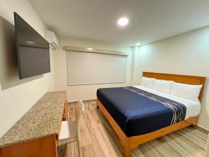 Postel nebo postele na pokoji v ubytování Hotel Catalina