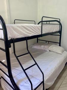 a couple of bunk beds in a room at Casa Irene in Orotina