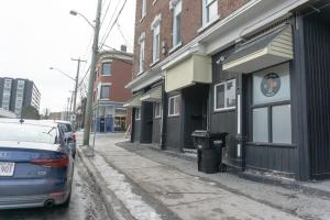 a car parked on a street next to a building at Cozy Studio In the Heart Uptown Saint John! Parking Coffee in Saint John