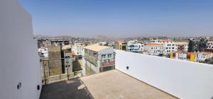 a view of a city from the balcony of a building at Flamingo Plateau 1A apt on Rua Pedonal Praia Cape Verde in Praia
