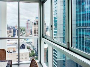 a view of a city from an office window at Amazing 1B1B Apt w/Pool, Gym, Sauna in Brisbane