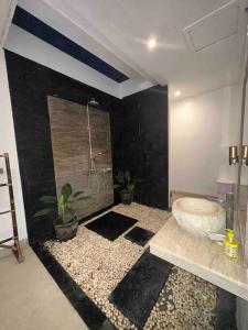 a bathroom with a bath tub in a room at UMARA villa bali x villa aydin kerobokan bali in Seminyak +19 photos
