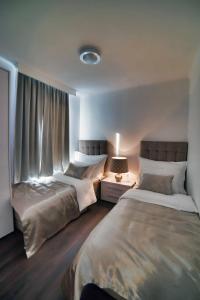 Posteľ alebo postele v izbe v ubytovaní CASA V BENCUN Luxury Apartments