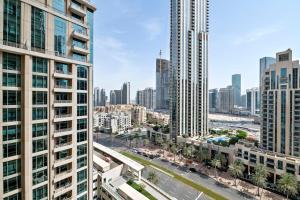 an aerial view of a city with tall buildings at Silkhaus chic 1BDR with patio near Burj Khalifa in Dubai