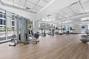 a gym with treadmills and machines in a building at Silkhaus spacious studio in Art Gardens with gym & pool access in Dubai