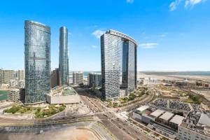 an aerial view of a city with tall buildings at Silkhaus High Floor 1 BDR Al Fay Park Nearby in Abu Dhabi