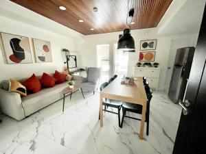 a living room with a couch and a table at San Lorenzo Place in Manila