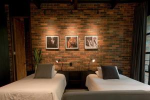 Postel nebo postele na pokoji v ubytování Hotel Meridiano Lofts