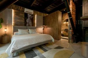 Postel nebo postele na pokoji v ubytování Hotel Meridiano Lofts