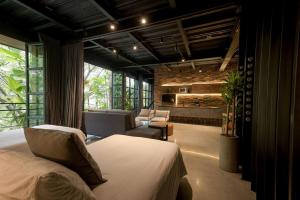 Postel nebo postele na pokoji v ubytování Hotel Meridiano Lofts
