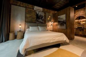 Postel nebo postele na pokoji v ubytování Hotel Meridiano Lofts