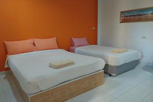 Postel nebo postele na pokoji v ubytování Review Resort