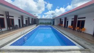 a view of a swimming pool in a hotel at Morika Inn in Waikabubak