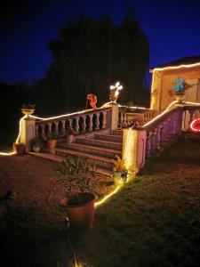 a house with lights on the stairs at night at jeanguy andrieu in Labruguière