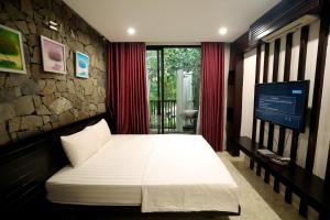 Giường trong phòng chung tại Villa Owner tại khu nghỉ dưỡng sinh thái Đại Lải Resort