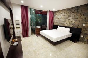 Giường trong phòng chung tại Villa Owner tại khu nghỉ dưỡng sinh thái Đại Lải Resort