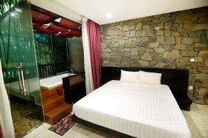 Giường trong phòng chung tại Villa Owner tại khu nghỉ dưỡng sinh thái Đại Lải Resort