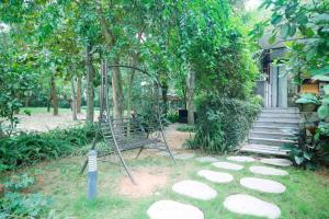 Vườn quanh Villa Owner tại khu nghỉ dưỡng sinh thái Đại Lải Resort