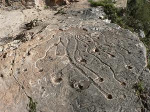 a rock with animal tracks on it at Hotel Bia Maore in Baunei
