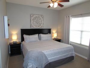 a bedroom with a large bed with two night stands at Walk-in level Condo B-6 Near Lake in Hollister