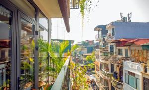 a view of a city street from a building at Mimosa Homestay in Hanoi
