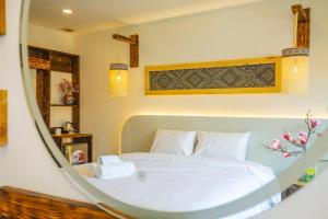 Mimosa Homestay Hanoi房間的床