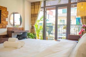 Mimosa Homestay Hanoi房間的床