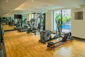 a gym with several treadmills and exercise bikes at Fairfield by Marriott Goa Anjuna in Anjuna
