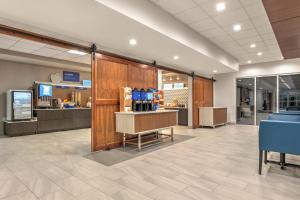 a lobby of a store with a cash counter and chairs at Holiday Inn Express - San Antonio East I-10 , an IHG Hotel in San Antonio