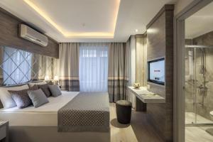 Postel nebo postele na pokoji v ubytování Hotel Turan Prince - Ex Sentido Turan Prince