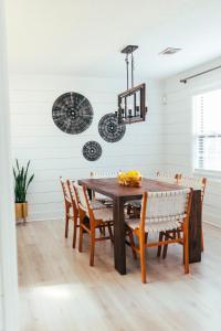a dining room with a wooden table and chairs at Cozy Family-Friendly home w/ fenced-in backyard in Marietta