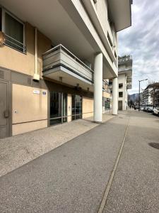 a building with an empty sidewalk in front of it at Annecy gare in Annecy